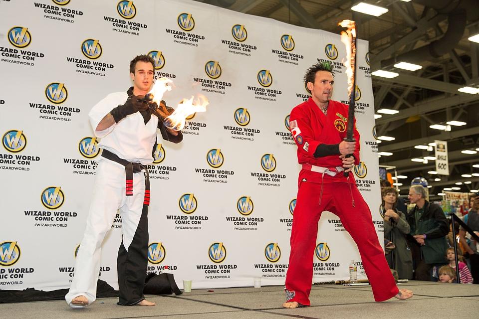 Sam Sprague (L) and Jason David Frank (R) attend the Wizard World Austin Comic Con at the Austin Convention Center on November 22, 2013.