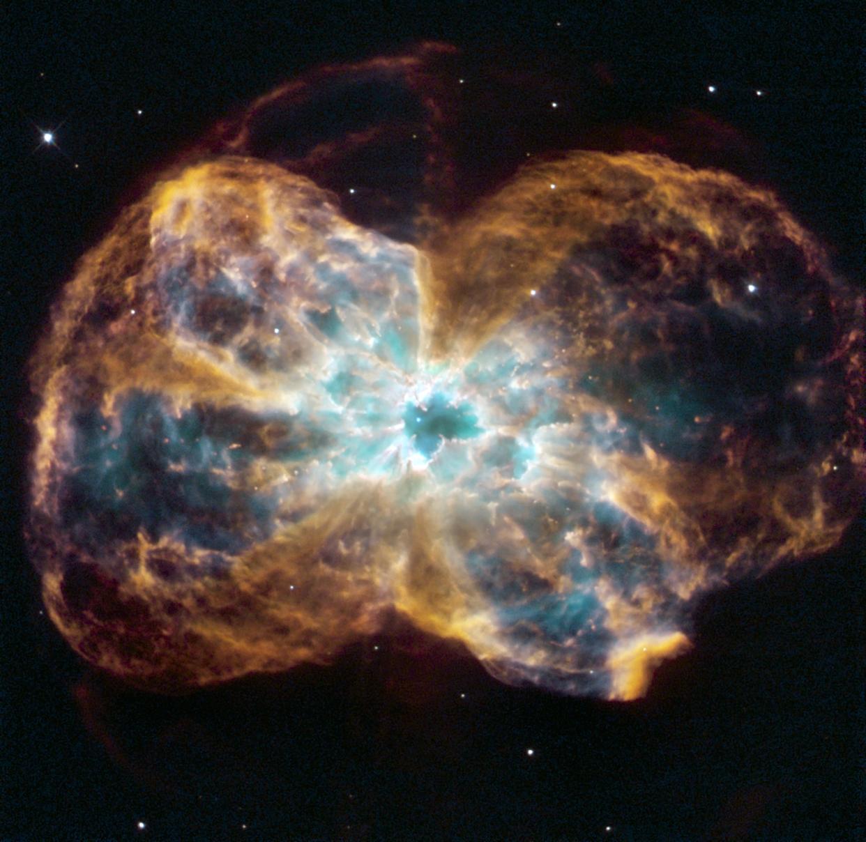 The star is ending its life by casting off its outer layers of gas, which formed a cocoon around the star's remaining core. Ultraviolet light from the dying star makes the material glow. The burned-out star, called a white dwarf, is the white dot in the center. Hubble Space Telescope (HST). (Photo by: Universal History Archive/Universal Images Group via Getty Images)