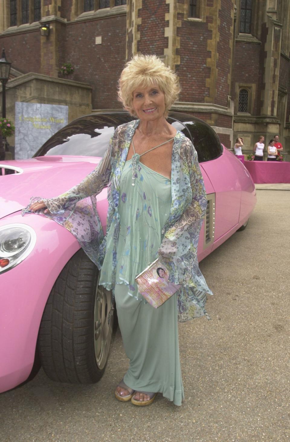 Sylvia Anderson Who Was The Voice Of The Original Lady Penelope In The Thunderbirds Tv Series At The Film Premiere Of Film Thunderbirds At The Empire Leicester Square London Pictured With Lady Penelope's Pink Car From The Film