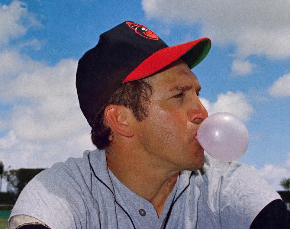 Brooks Robinson, third baseman for the Baltimore Orioles, blows a bubble in 1969. Robinson, whose deft glovework and folksy manner made him one of the most beloved and accomplished athletes in Baltimore history, has died. He was 86. The Orioles announced his death in a joint statement with Robinson's family Tuesday, Sept. 26, 2023. The statement did not say how Robinson died.