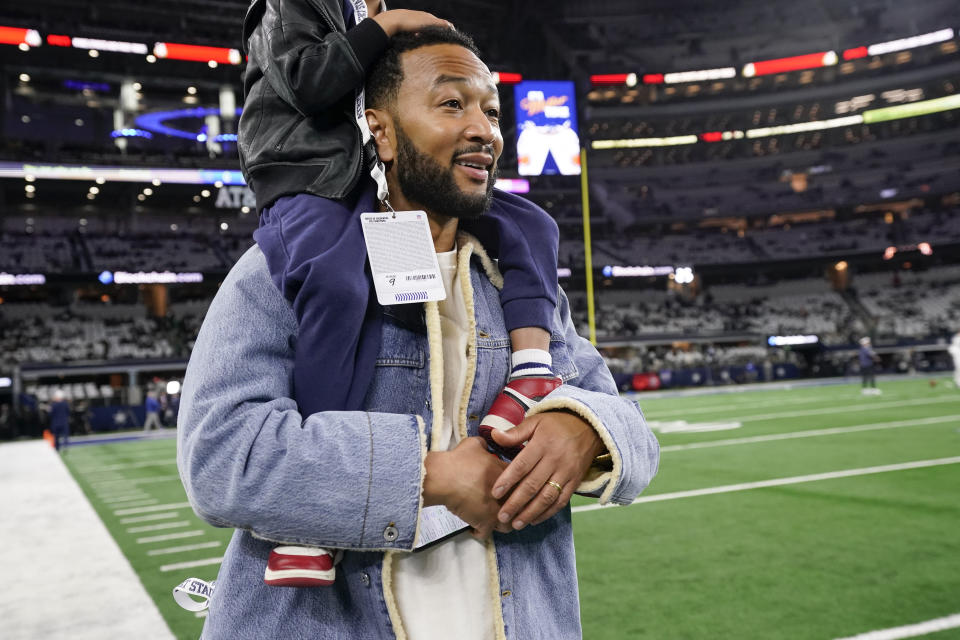 American songwriter John Legend looks on prior to an NFL football game between the Dallas Cowboys and the Philadelphia Eagles, Sunday, Dec. 10, 2023, in Arlington, Texas. (AP Photo/Sam Hodde)