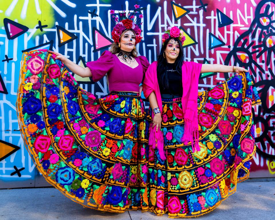 Nataly Andrade, left, and Galy Montes, founders of Mercadera Market, pose for a photo at the Día de los Muertos-themed market on Sunday, October 23, 2022, at the Zócalo Food Park in Milwaukee, Wis.