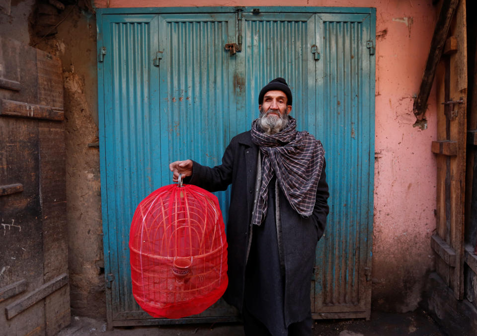 Vendor poses with birds