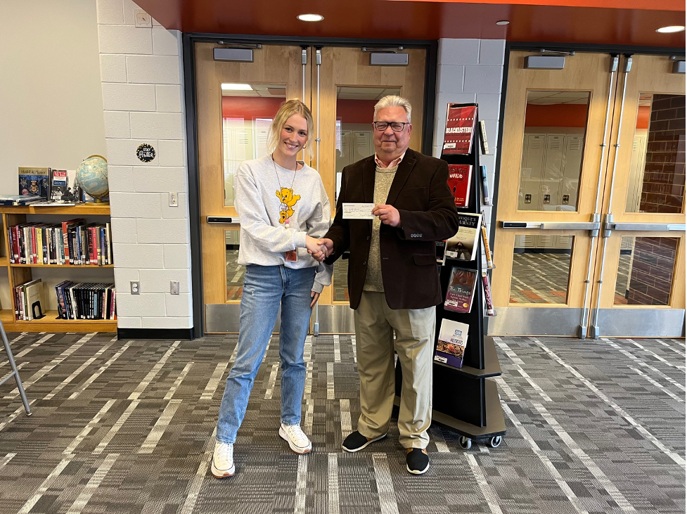 Harbor Springs special education teacher Lydia Brown (left) was a recipient of a $100 MARSP mini-grant. Emmet County MARSP chapter interim president and treasurer Dave Snyder (right) is delivering the honorariums to the different awardees.