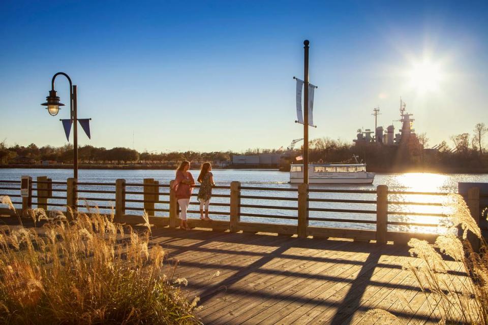 Guests can stroll the Riverwalk while visiting the Battleship North Carolina in Wilmington.