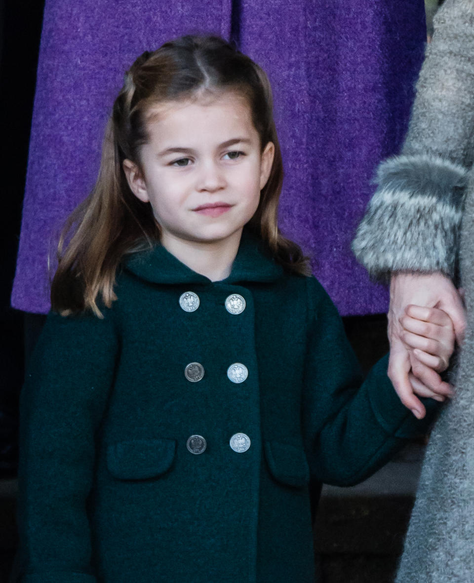 KING'S LYNN, ENGLAND - DECEMBER 25: Princess Charlotte of Cambridge is given a hug by a wellwisher as she attends the Christmas Day Church service at Church of St Mary Magdalene on the Sandringham estate on December 25, 2019 in King's Lynn, United Kingdom. (Photo by Pool/Samir Hussein/WireImage)