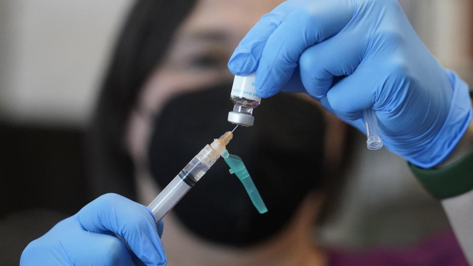 FILE - A registered nurse prepares a dose of a Monkeypox vaccine at the Salt Lake County Health Department Thursday, July 28, 2022, in Salt Lake City. On Friday, Aug. 5, The Associated Press reported on stories circulating online incorrectly claiming Monkeypox can only be spread among gay men. (AP Photo/Rick Bowmer)