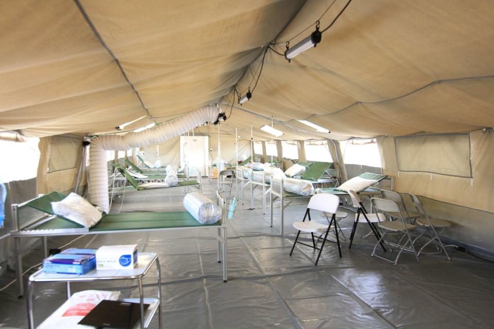 In this photo provided by the International Committee for the Red Cross the interior of a new field hospital for coronavirus patients in the Yemen's main southern city of Aden. The Red Cross announced the opening of the facility on Monday, Sept. 21, 2020 as the virus continues to spread largely unchecked in the war-torn country. Many medical facilities in the country have closed as staffers flee or turn patients away. (International Committee for the Red Cross via AP)