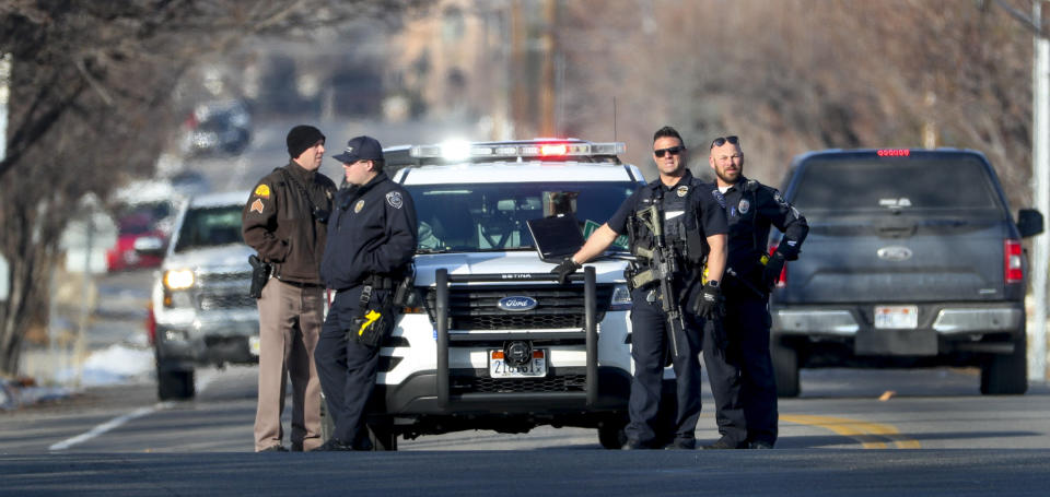 Law enforcement officers are on alert at Winchester Street and 700 E. following a shooting at Fashion Place Mall in Murray, Utah on Sunday, Jan. 13, 2019. (Steve Griffin/The Deseret News via AP)