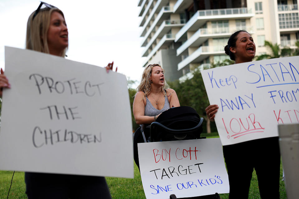 Yulia K., Melissa Caicedo, and Jennifer Vazquez protest the retailer's Pride collection outside of a Target store on June 1, 2023 in Miami.