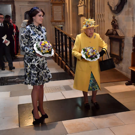 Britain's Queen Elizabeth and Princess Eugenie of York hold nosegays as they arrive for the Royal Maundy service at St George's Chapel in Windsor, Britain April 18, 2019. Arthur Edwards/Pool via REUTERS