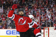 New Jersey Devils left wing Tomas Tatar (90) reacts after scoring a goal against the Arizona Coyotes during the first period of an NHL hockey game, Saturday, Nov. 12, 2022, in Newark, N.J. (AP Photo/Noah K. Murray)