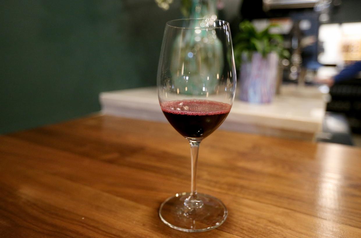 A glass of poured wine sits on the bar Monday, March 11, 2024, at the L Wine Bar at 530 E. Lexington Ave. in Elkhart. The site formerly was the 530 Wine Bar.