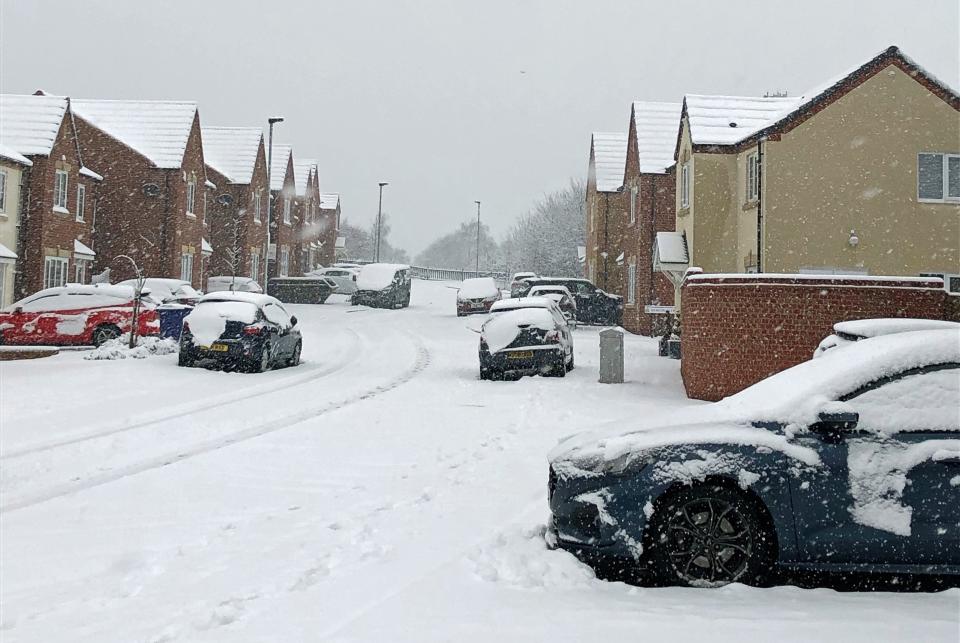 Snow covers a road in Monk Bretton, Barnsley, South Yorkshire,PA