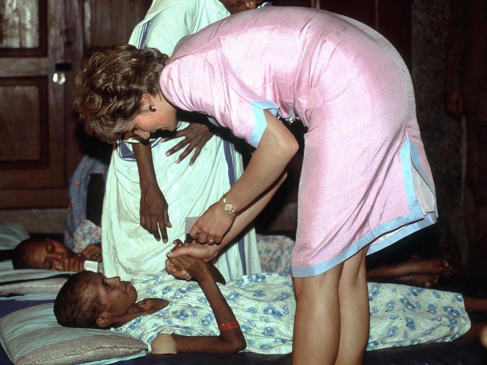 Princess Diana helping a patient at Mother Teresa's hospice in Calcutta, India, in 1992.