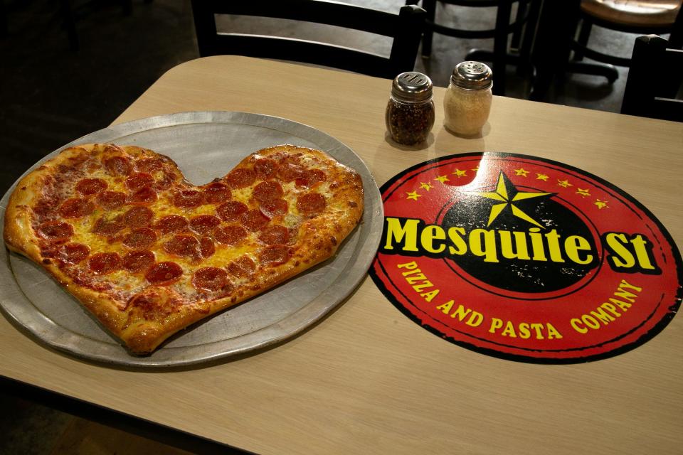 A heart-shaped pepperoni pizza, made by pizzaiolo Robert Treto, sits on a table at Mesquite Street Pizza and Pasta Co. on Wednesday, Feb. 8, 2023.