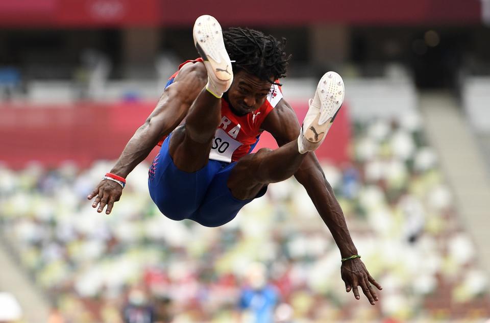 Cuba's Maykel Masso ltakes off in the men's long jump final.