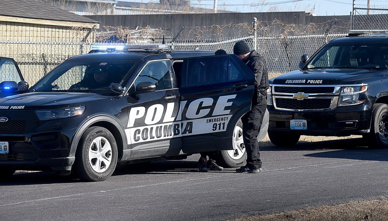 Columbia police take a man into custody for an outstanding warrant following a traffic stop in January.