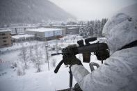 Police is on guard on top of the Congress Center on the eve of the 47th Annual Meeting of the World Economic Forum, WEF, in Davos, Switzerland, Monday, Jan. 16, 2017. (Gian Ehrenzeller/Keystone via AP)