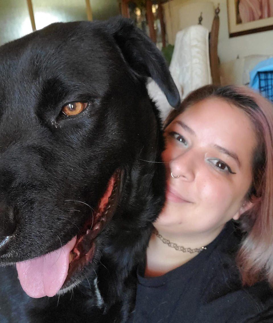 Image: Nicole Salinas-Labrador and Taco together in her home (Courtesy of Nicole Salinas-Labrador)