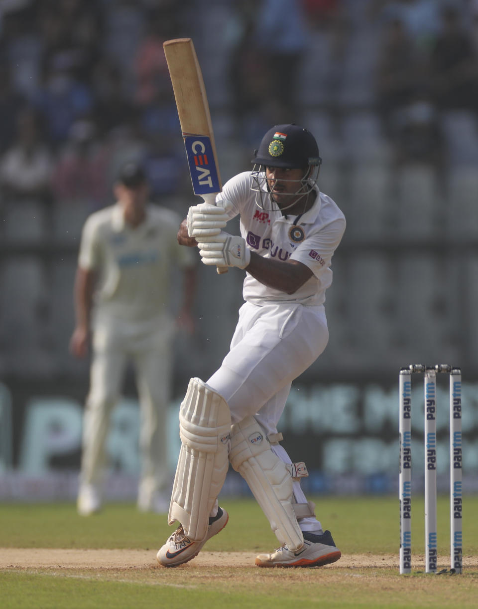 India's Mayank Agarwal plays shot during the day three of their second test cricket match with New Zealand in Mumbai, India, Sunday, Dec. 5, 2021.(AP Photo/Rafiq Maqbool)