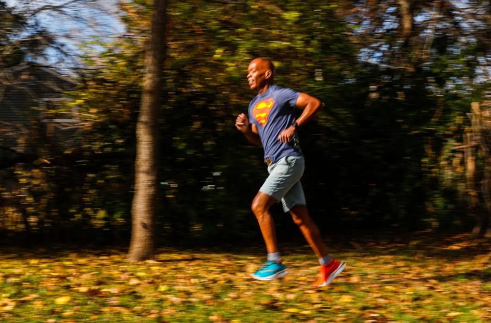 Corey Queen has found inspiration as well as health benefits from running. "When you cross the finish line you are a different person when you started," said Queen, 53. "You forfeited the right to say anything is too hard." Nov. 14, 2023.