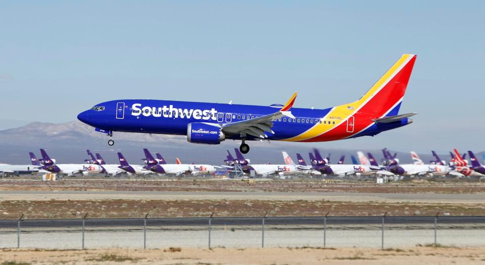 In this March 23, 2019 file photo a Southwest Airlines Boeing 737 Max aircraft lands at the Southern California Logistics Airport in the high desert town of Victorville, Calif. Southwest said Thursday, Oct. 17, that it will keep its Boeing 737 Max jets out of its schedule until Feb. 8, about a month longer than previously planned.