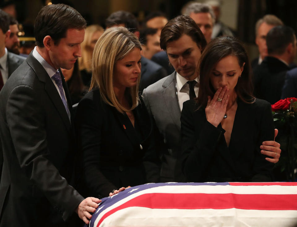 Jenna Bush Hager, middle, stands at her grandfather's coffin in the rotunda of the U.S. Capitol. (Photo: Mark Wilson/Getty Images)