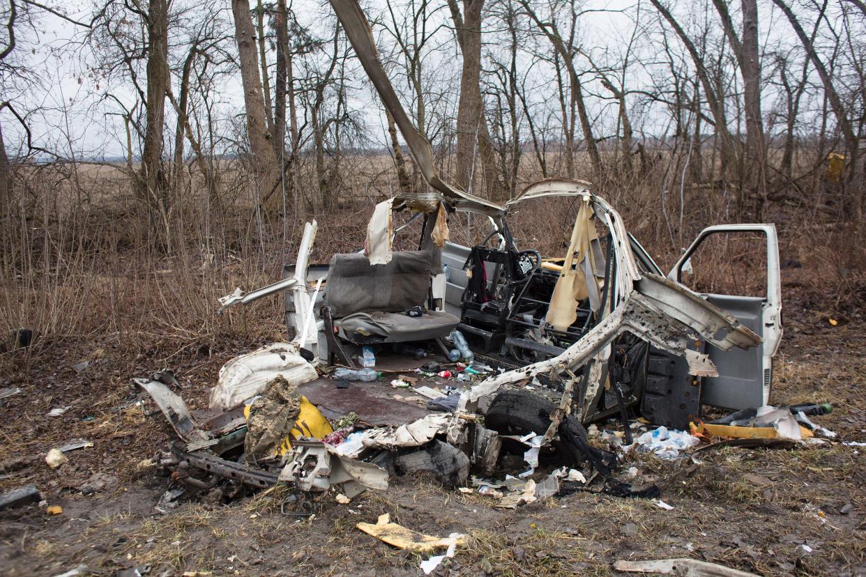A destroyed vehicle is seen on March 3, 2022, in Sytniaky, Ukraine, west of the capital.