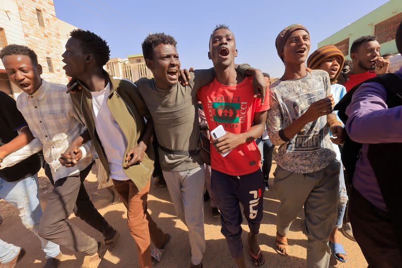 People attend a protest rally in Khartoum