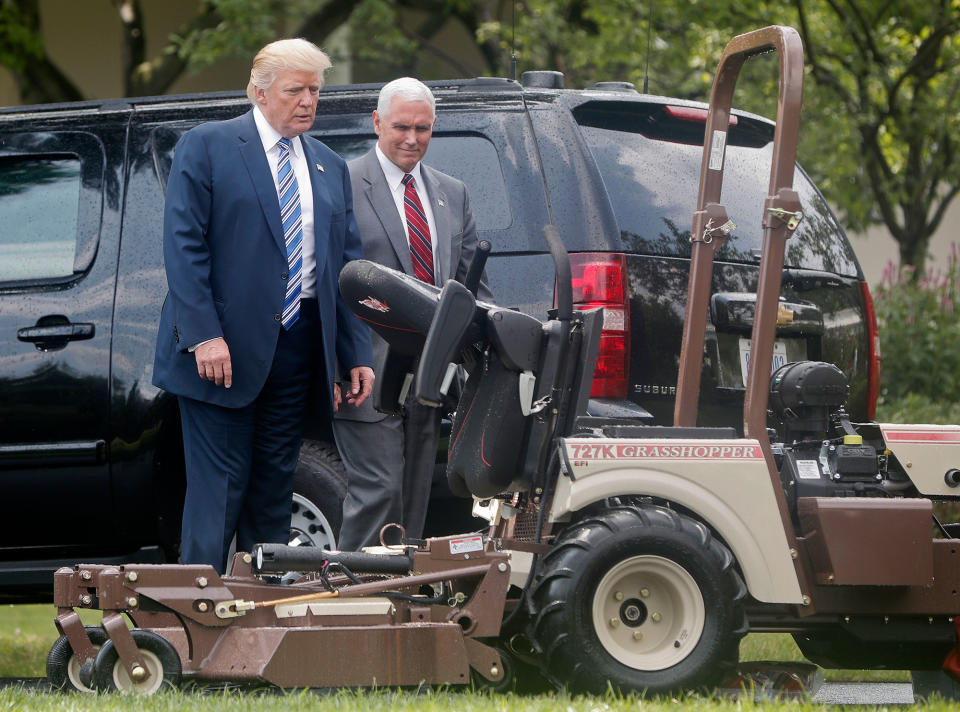 <p>President Trump and Vice President Mike Pence look at a lawnmower manufactured by Grasshopper Company in Kansas on the South Lawn of the White House in Washington on July 17, 2017, during a “Made in America” product showcase featuring items created in each of the U.S. 50 states. (AP Photo/Pablo Martinez Monsivais) </p>