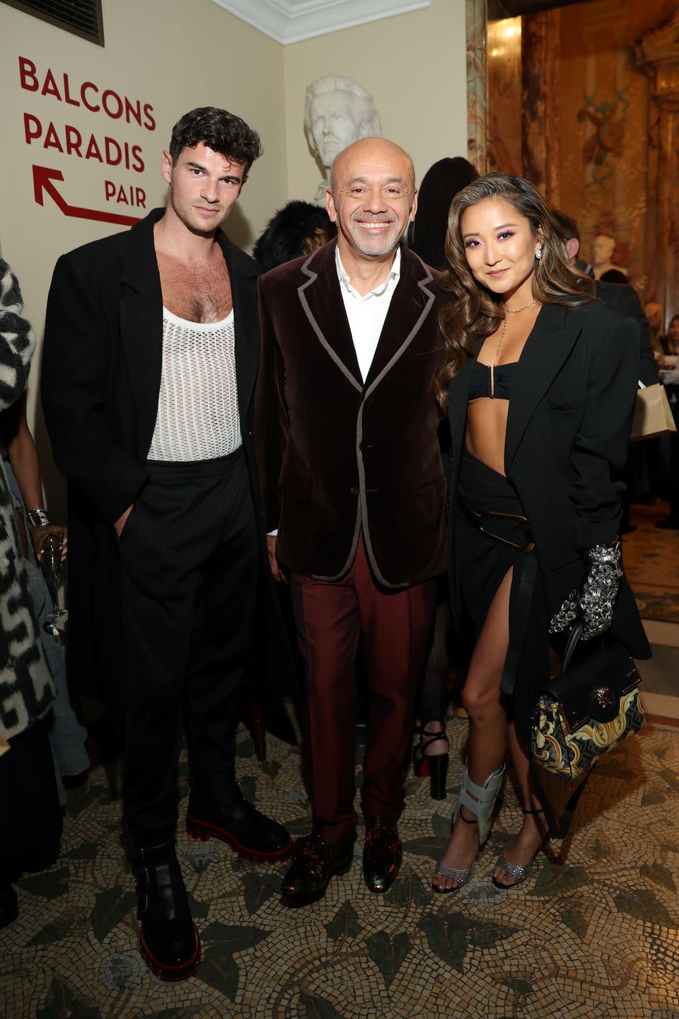 paris, france march 02 l r paul forman, christian louboutin, and ashley park attend the loubi show as part of paris fashion week on march 02, 2023 in paris, france photo by victor boykogetty images for christian louboutin