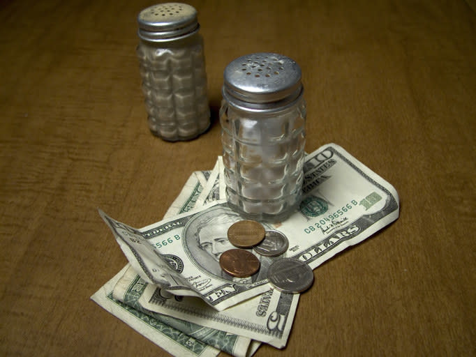 A cash tip left on a restaurant table