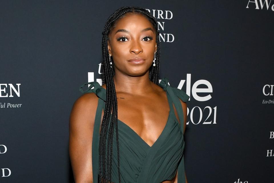 <p>Jon Kopaloff/Getty </p> Honoree Simone Biles attends the 2021 InStyle Awards at The Getty Center