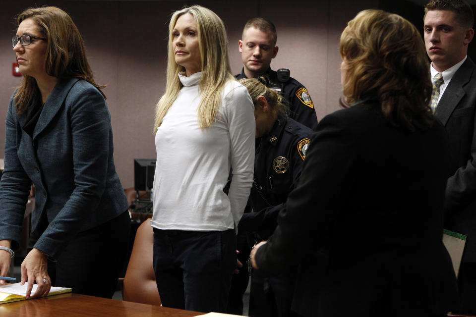 Former "Melrose Place" actress Amy Locane-Bovenizer, 40, second from left, of Hopewell Township, N.J. is taken into custody after jurors in Somerville, N.J., convicted her of vehicular homicide. At left is her attorney Ellen Torregrossa-O'Connor. (AP Photo/Robert Sciarrino, pool)