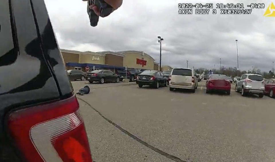 In this image taken from police body camera video released by the East Lansing Police, DeAnthony VanAtten lays on the ground after being shot by East Lansing, Mich., police on April 25, 2022, while responding to a call about a shopper with a gun. Police released video of the incident Thursday, May 5, 2022. State police are investigating the shooting. DeAnthony VanAtten’s injuries were not life-threatening. (East Lansing Police via AP)