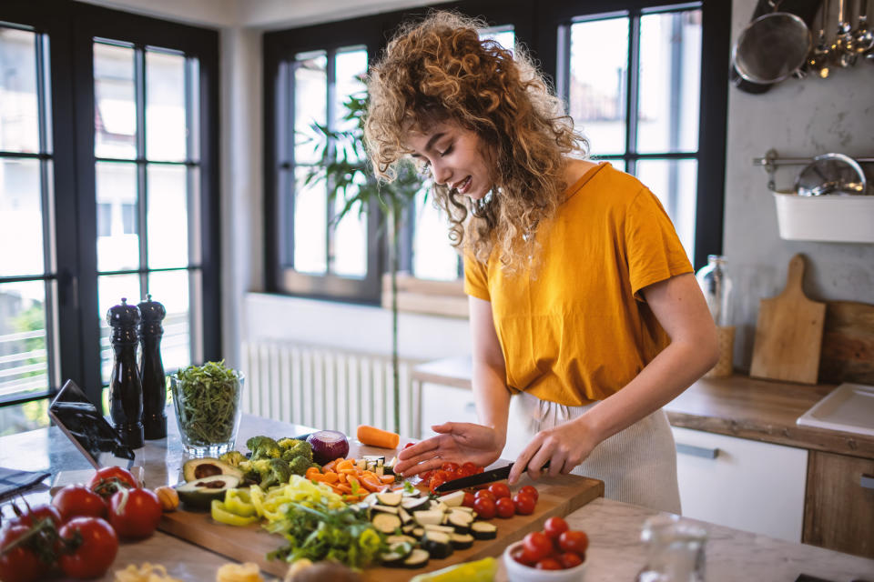 A woman cutting vegetables