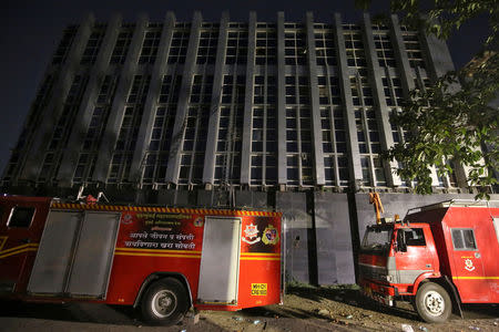 Fire engines are parked in front of a partially damaged hospital after it caught fire in the suburbs of Mumbai, India, December 17, 2018. REUTERS/Francis Mascarenhas