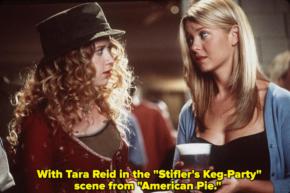 Lyonne and Tara Reid look at each other in a party scene from "American Pie"