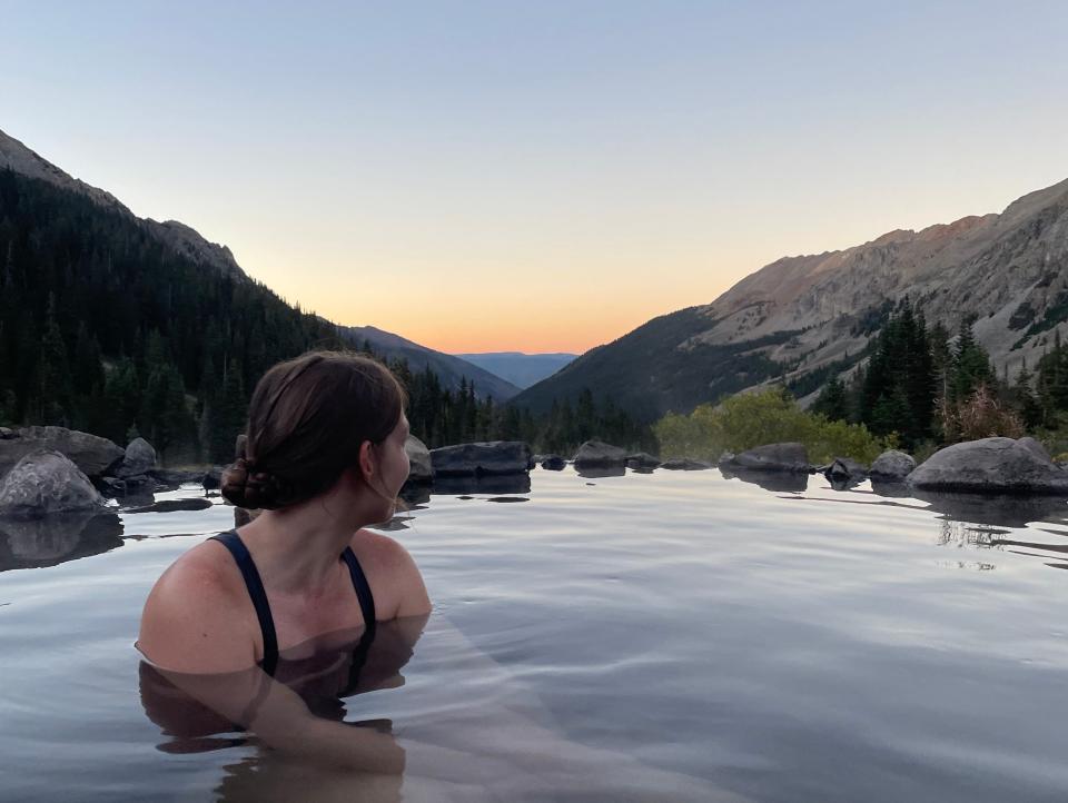 Insider's author in a hot spring she backpacked to.