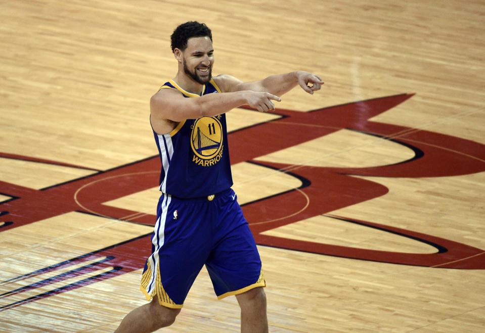 Golden State Warriors' Klay Thompson (11) celebrates his 3-point basket during the second half of Game 6 of the team's second-round NBA basketball playoff series against the Houston Rockets on Friday, May 10, 2019, in Houston. (AP Photo/Eric Christian Smith)