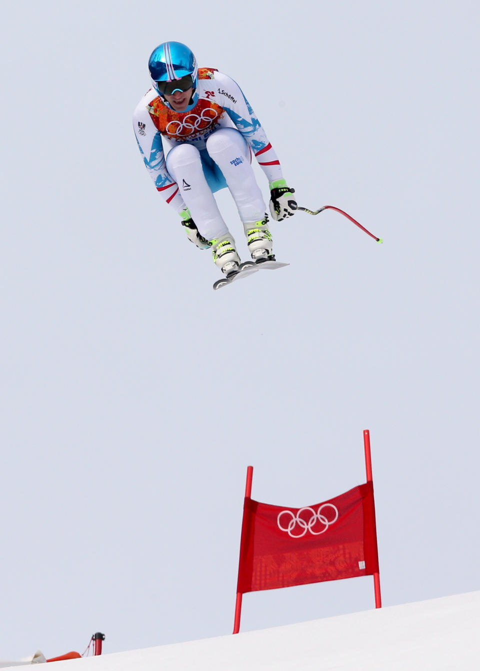 Austria's gold medalist Matthias Mayer jumps during the men's downhill at the Sochi 2014 Winter Olympics, Sunday, Feb. 9, 2014, in Krasnaya Polyana, Russia.(AP Photo/Luca Bruno)