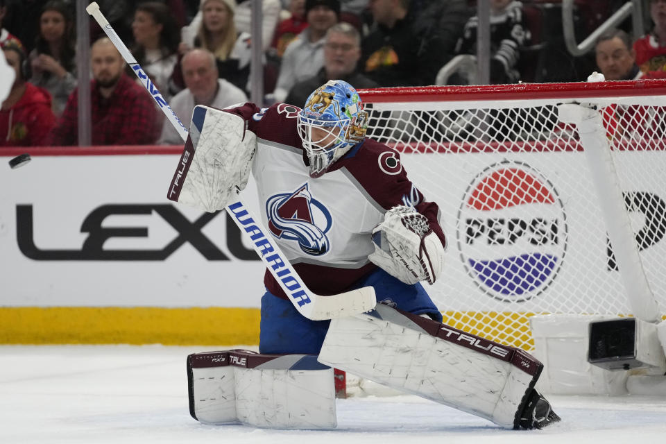 Colorado Avalanche goaltender Alexandar Georgiev deflects the puck during the second period of an NHL hockey game against the Chicago Blackhawks Tuesday, Dec. 19, 2023, in Chicago. (AP Photo/Erin Hooley)