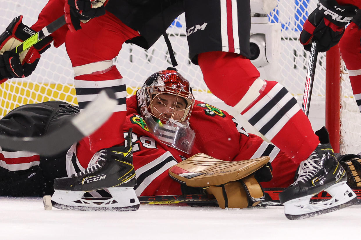 CHICAGO, IL - OCTOBER 19: Chicago Blackhawks goaltender Marc-Andre Fleury (29) dives on the ice to block a shot during a game between the Chicago Blackhawks and the New York Islanders on October 19, 2021 at the United Center in Chicago, IL. (Photo by Robin Alam/Icon Sportswire via Getty Images)