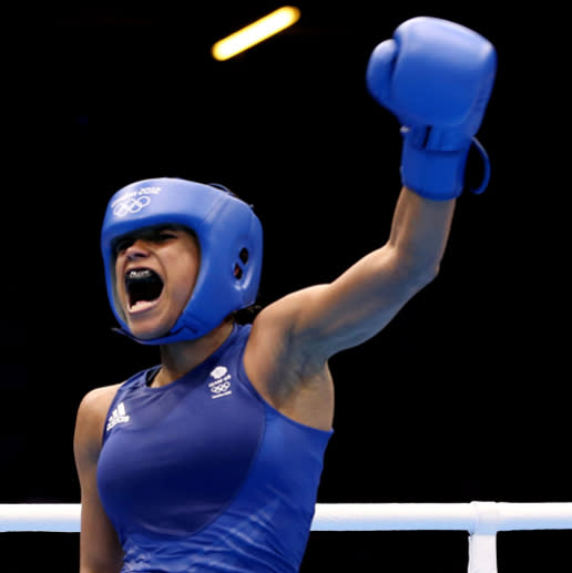 LONDON, ENGLAND - AUGUST 05: Natasha Jonas of Great Britain celebrates her victory over Quanitta Underwood of United States during the Women's Light (57-60kg) Boxing on Day 9 of the London 2012 Olympic Games at ExCeL on August 5, 2012 in London, England. (Photo by Scott Heavey/Getty Images)