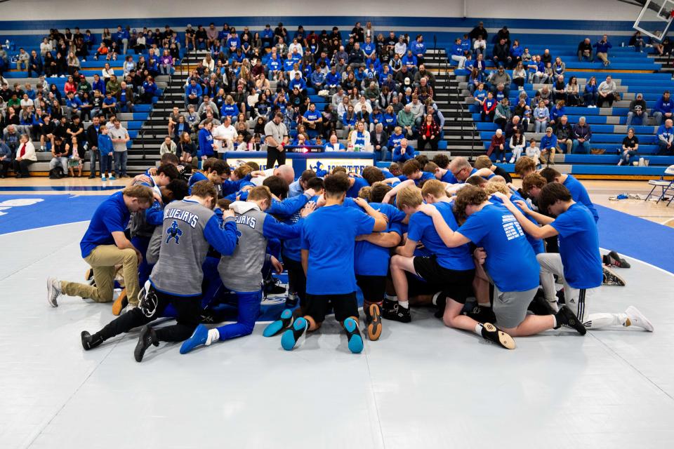 Members of both Perry and Roland-Story wrestling teams met on the mat for a moment of silence to honor the victims of the Perry school shooting Tuesday, Jan. 30, 2024, at Perry High School.