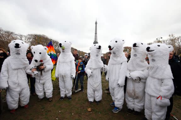 Demonstrators dressed up as polar bears take part to a rally during the Paris climate change conference, Dec. 12, 2015.