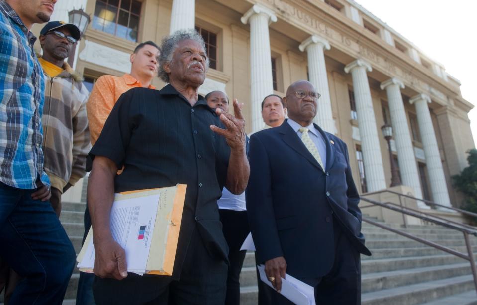 20161004Activist and former city councilman Ralph Lee White, front left, standing next to Stockton NAACP branch president Bobby Bivens, speaks out during a press conference in front of City Hall in downtown Stockton about a recent police involved shooting. CLIFFORD OTO/THE RECORDTransmission Reference: REC1610042007585809