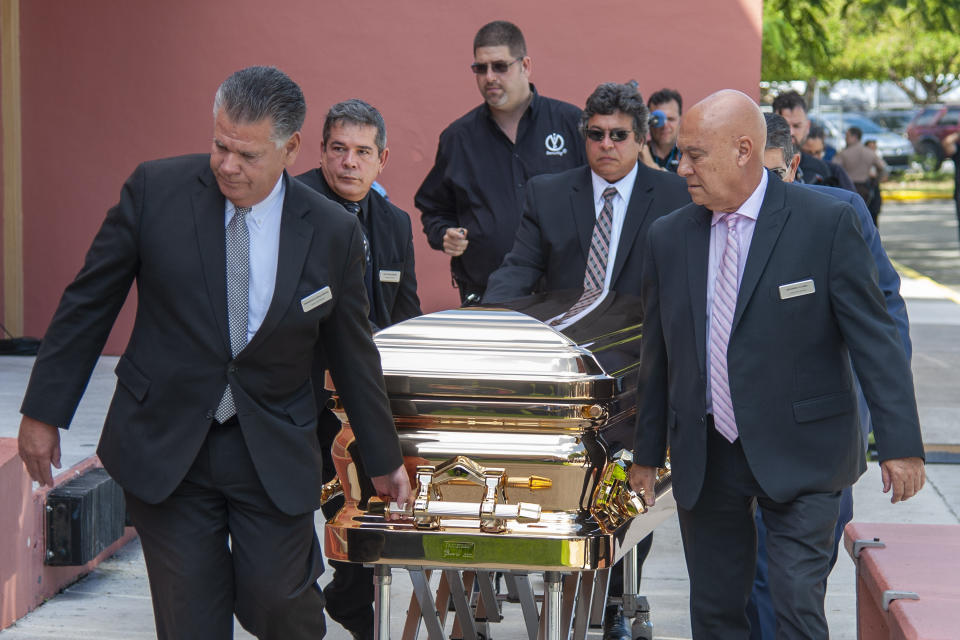 The casket with the remains of Mexican singer Jose Jose is wheeled into the Miami Dade County Auditorium for a public viewing Sunday, October 6, 2019 in Miami. (AP Photo/Gaston De Cardenas)