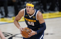 Denver Nuggets forward Aaron Gordon looks to pass the ball during the second half of the team's NBA basketball game against the Orlando Magic on Sunday, April 4, 2021, in Denver. (AP Photo/David Zalubowski)